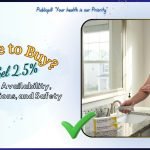 An American man in a bright bathroom applying Andractim DHT Gel 2.5% to his arm, with prescription boxes on the marble counter.